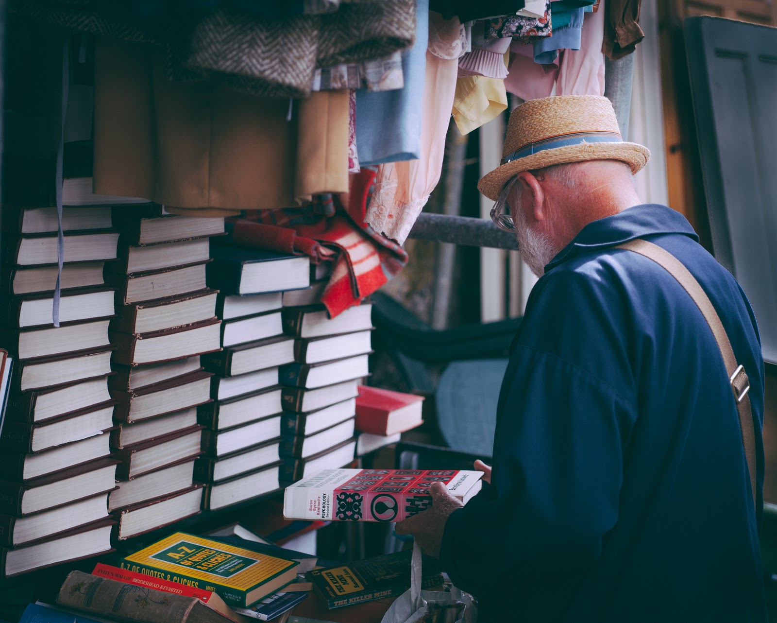 man choosing book, book title