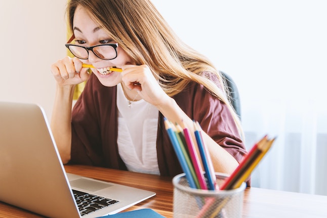 woman intent on computer screen for author platform