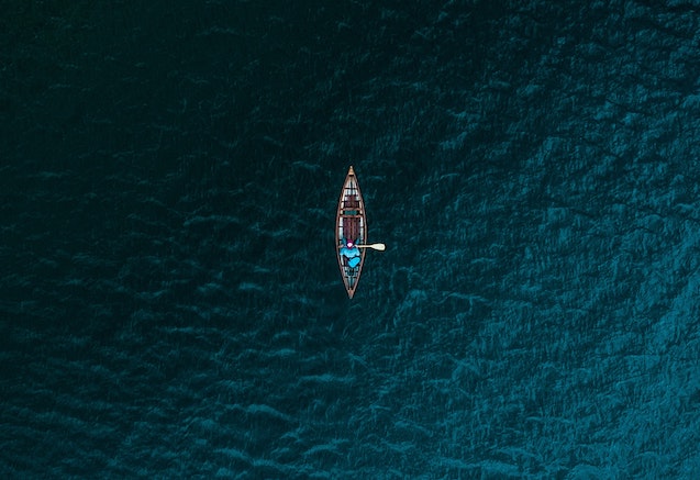 overhead view ofcanoe surrounded by water