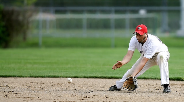 baseman fielding a grounder