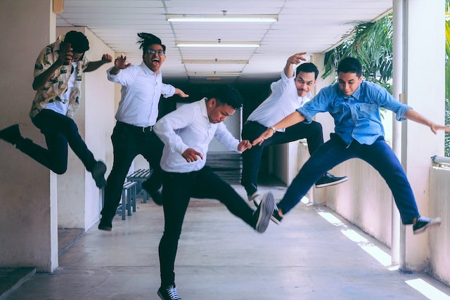 five men jumping in the air