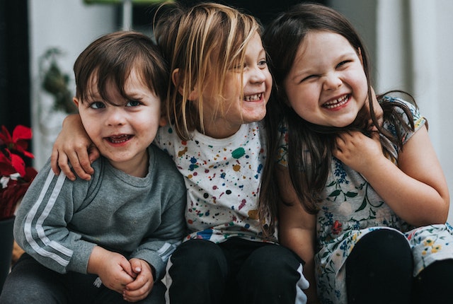 three happy children represent three ways to write a first draft