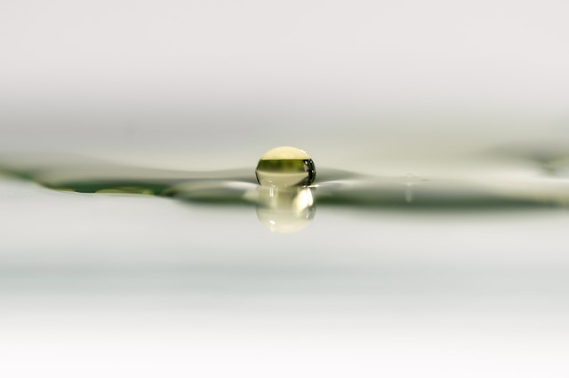 bubble of water suspended by surface tension illustrating micro tension moments in a novel