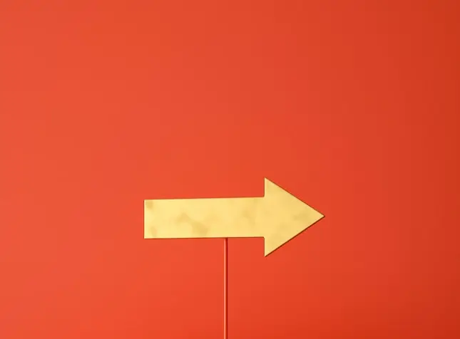 yellow arrow on a red stick pointing right