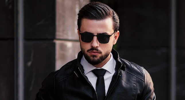 man in leather jacket and sunglasses representing a detective character