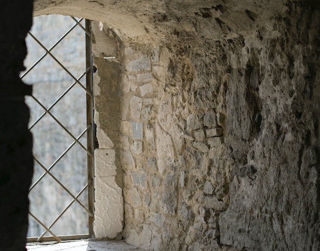 Castle window viewed from inside stone walls illustrating inside out writing